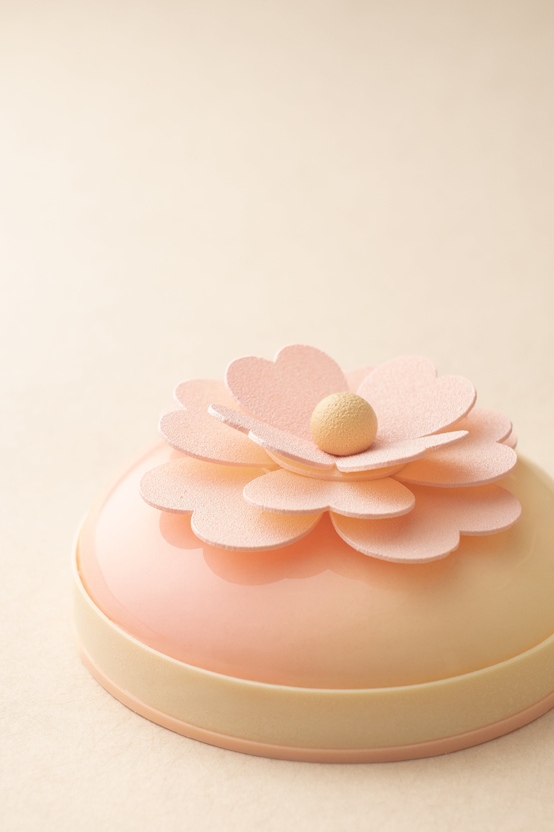 Pink Blossom cake front view — floral petal design with almond croustillant base