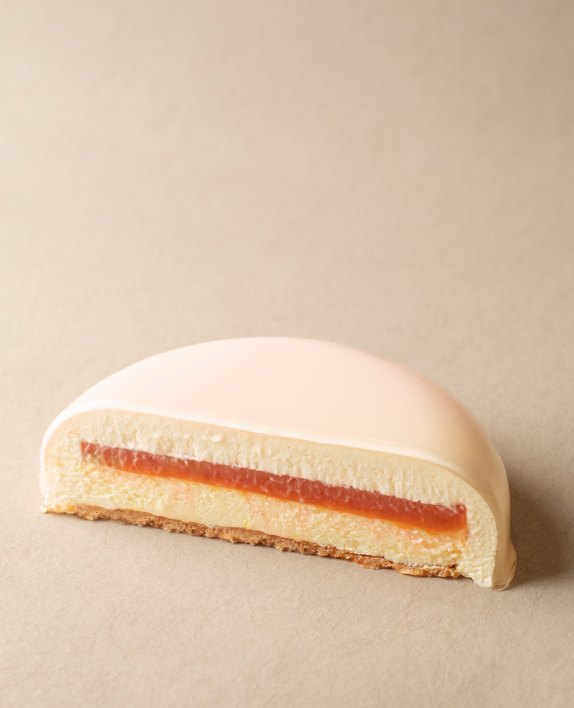 Pink Blossom cake slice showing Blood Orange Jelly and Grapefruit Confit layers inside cheesecake